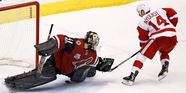 Detroit Red Wings right wing Gustav Nyquist (14) scores a goal against Arizona Coyotes goalie Mike ...