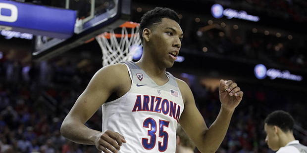 Arizona's Allonzo Trier reacts after a play against UCLA during the first half of an NCAA college b...