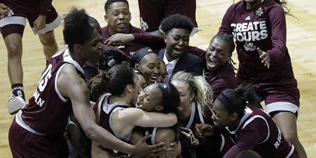 Mississippi State guard Morgan William, center, celebrates with teammates after she hit the winning...
