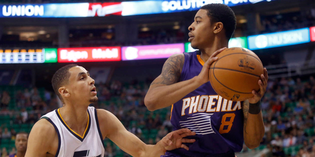 Phoenix Suns' Tyler Ulis (8) looks to pass the ball as Utah Jazz's Marcus Paige (16) defends during...