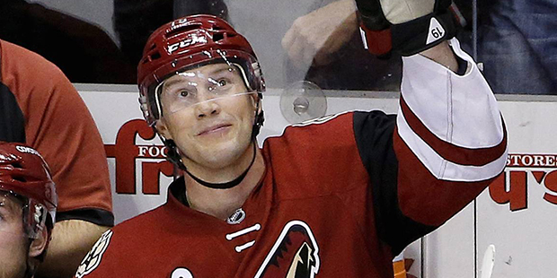 Arizona Coyotes' Shane Doan waves to a cheering crowd after Doan became the franchise leader in poi...