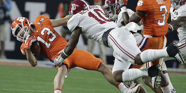 Alabama's Reuben Foster tackles Clemson's Hunter Renfrow (13) during the first half of the NCAA col...