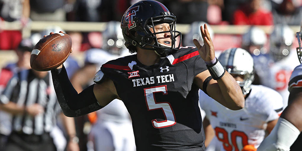 Texas Tech quarterback Patrick Mahomes (5) passes under pressure from Oklahoma State defensive end ...