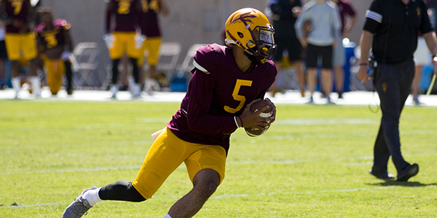 Arizona State redshirt junior quarterback Manny Wilkins (5) runs with the football during the annua...