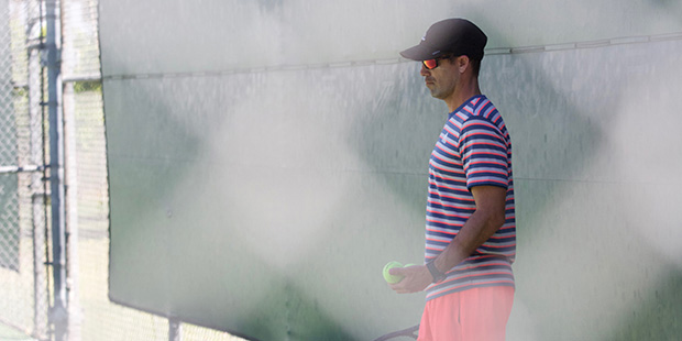 ASU men’s tennis head coach Matt Hill gathers tennis balls at Whiteman Tennis Center on Monday, A...