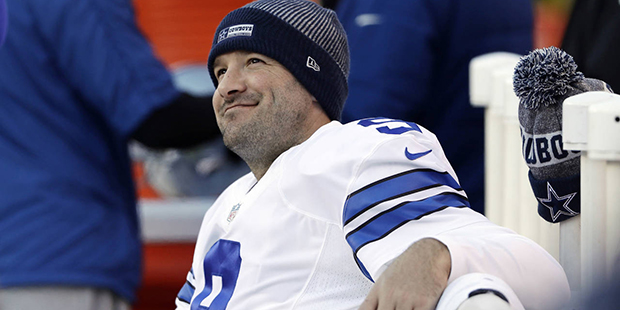 FILE - In this Jan. 1, 2017, file photo, Dallas Cowboys' Tony Romo smiles on the bench during the s...