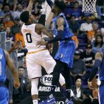 Dallas Mavericks center Nerlens Noel (3) blocks the shot of Phoenix Suns forward Marquese Chriss during the first half of an NBA basketball game, Sunday, April 9, 2017, in Phoenix. (AP Photo/Ralph Freso)