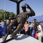 A bronze statue of Brooklyn Dodgers great Jackie Robinson is unveiled outside Dodger Stadium before the Los Angeles Dodgers' baseball game with the Arizona Diamondbacks, Saturday, April 15, 2017, in Los Angeles. (AP Photo/Jae C. Hong)