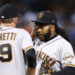 San Francisco Giants pitching coach Dave Righetti (19) visits with pitcher Johnny Cueto, right, during the fourth inning of a baseball game against the Arizona Diamondbacks Tuesday, April 4, 2017, in Phoenix. (AP Photo/Ross D. Franklin)