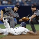Arizona Diamondbacks second baseman Brandon Drury, right, applies a tag on San Diego Padres' Wil Myers, center, as he is caught stealing second, with shortstop Nick Ahmed, left, in on the play during the fourth inning of a baseball game in San Diego, Thursday, April 20, 2017. (AP Photo/Alex Gallardo)