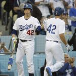 Los Angeles Dodgers' Austin Barnes, right, celebrates his home run with Kenta Maeda, of Japan, during the second inning of a baseball game against the Arizona Diamondbacks, Saturday, April 15, 2017, in Los Angeles. (AP Photo/Jae C. Hong)