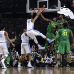 North Carolina forward Isaiah Hicks (4) dunks the ball over Oregon's Kavell Bigby-Williams (35) and Jordan Bell (1) during the first half in the semifinals of the Final Four NCAA college basketball tournament, Saturday, April 1, 2017, in Glendale, Ariz. (AP Photo/David J. Phillip)
