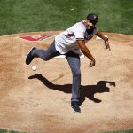 Former NBA basketball player Grant Hill throws out the first pitch for an opening day baseball game between the Arizona Diamondbacks and the San Francisco Giants on Sunday, April 2, 2017, in Phoenix. (AP Photo/Ross D. Franklin)