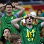Oregon fans react after the semifinals of the Final Four NCAA college basketball tournament between North Carolina and Oregon, Saturday, April 1, 2017, in Glendale, Ariz. North Carolina won 77-76. (AP Photo/Charlie Neibergall)
