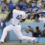 Los Angeles Dodgers' Corey Seager follows through on an RBI single during the first inning of a baseball game against the Arizona Diamondbacks, Saturday, April 15, 2017, in Los Angeles. (AP Photo/Jae C. Hong)