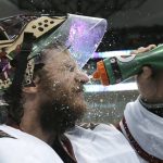 Arizona Coyotes goalie Mike Smith sprays his face with water during a break in play in the second period of the team's NHL hockey game against the Dallas Stars in Dallas, Tuesday, April 4, 2017. (AP Photo/LM Otero)