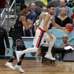 Gonzaga's Nigel Williams-Goss, right, and South Carolina's PJ Dozier chase a loose ball during the second half in the semifinals of the Final Four NCAA college basketball tournament, Saturday, April 1, 2017, in Glendale, Ariz. (AP Photo/Matt York)
