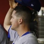 Los Angeles Dodgers' Alex Wood takes his hat off in the dugout after being pulled from the baseball game against the Arizona Diamondbacks during the fifth inning Friday, April 21, 2017, in Phoenix. (AP Photo/Ross D. Franklin)