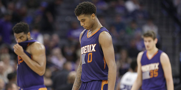 Phoenix Suns forward Marquese Chriss, center, walks off the court during a timeout in the closing m...
