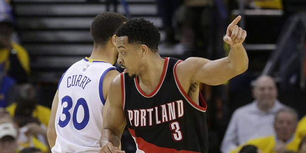 Portland Trail Blazers guard C.J. McCollum (3) gestures after scoring against the Golden State Warr...
