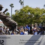 A bronze statue of Los Angeles Dodgers legend Jackie Robinson is unveiled outside Dodger Stadium before the team's baseball game with the Arizona Diamondbacks, Saturday, April 15, 2017, in Los Angeles. (AP Photo/Jae C. Hong)