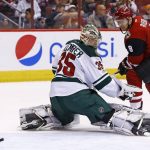 Arizona Coyotes' Tobias Rieder (8) sends a shot off the post as Minnesota Wild's Darcy Kuemper (35) looks at the puck during the second period of an NHL hockey game Saturday, April 8, 2017, in Glendale, Ariz. (AP Photo/Ross D. Franklin)