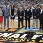 Basketball Hall of Fame members from left, Bill Self, Muffet McGraw, Tracy McGrady, Rebecca Lobo, Tom Jernstedt, Mannie Jackson and Robert Hughes stand with Jerry Colanego and John Doleva, president and CEO of the Hall of Fame, right, during halftime of the semifinal between Gonzaga and South Carolina in the Final Four NCAA college basketball tournament, Saturday, April 1, 2017, in Glendale, Ariz. (AP Photo/Mark Humphrey)