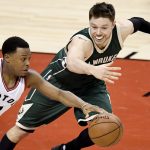 Toronto Raptors guard Kyle Lowry (7) takes off after a turnover as Milwaukee Bucks guard Matthew Dellavedova (8) defends during the second half of Game 2 of an NBA basketball first-round playoff series, Tuesday, April 18, 2017, in Toronto. (Frank Gunn/The Canadian Press via AP)