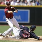 Arizona Diamondbacks shortstop Chris Owings gets the force out on Cleveland Indians Edwin Encarnacion (10) in the fourth inning during a baseball game, Sunday, April 9, 2017, in Phoenix. (AP Photo/Rick Scuteri)