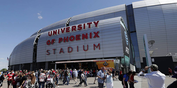 Fans arrive at University of Phoenix Stadium before the semifinals of the Final Four NCAA college b...