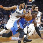 Oklahoma City Thunder's Victor Oladipo drives past Minnesota Timberwolves' Karl-Anthony Towns, left, during the second half of an NBA basketball game Tuesday, April 11, 2017, in Minneapolis. The Thunder won 100-98. (AP Photo/Jim Mone)