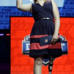 Kate Foster, 18, of Rockford, Ill., waves onstage while waiting to announce the Chicago Bears' selection in the second round of the 2017 NFL football draft, Friday, April 28, 2017, in Philadelphia. (AP Photo/Matt Rourke)