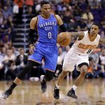 Oklahoma City Thunder guard Russell Westbrook (0) and Phoenix Suns guard Tyler Ulis (8) battle or the ball during the first half of an NBA basketball game, Friday, April 7, 2017, in Phoenix. (AP Photo/Matt York)