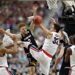 South Carolina's Hassani Gravett (2) battles for a rebound against Gonzaga's Johnathan Williams (3) and Zach Collins (32) during the first half in the semifinals of the Final Four NCAA college basketball tournament, Saturday, April 1, 2017, in Glendale, Ariz. (AP Photo/David J. Phillip)
