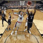 Gonzaga's Zach Collins (32) and South Carolina's Sindarius Thornwell (0) battle for a rebound during the second half in the semifinals of the Final Four NCAA college basketball tournament, Saturday, April 1, 2017, in Glendale, Ariz. (AP Photo/Chris Steppig, Pool)