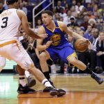 Golden State Warriors guard Klay Thompson (11) drives against Phoenix Suns forward Jared Dudley (3) during the first half of an NBA basketball game, Wednesday, April 5, 2017, in Phoenix. (AP Photo/Matt York)