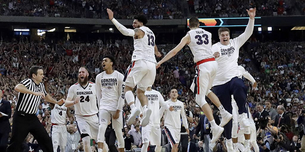 Gonzaga players celebrate after the semifinals of the Final Four NCAA college basketball tournament...