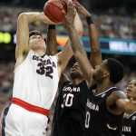 South Carolina's Chris Silva (30) and Sindarius Thornwell (0) block a shot by Gonzaga's Zach Collins (32) during the second half in the semifinals of the Final Four NCAA college basketball tournament, Saturday, April 1, 2017, in Glendale, Ariz. (AP Photo/Mark Humphrey)