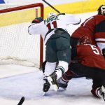 Arizona Coyotes' Mike Smith, top right, gives up a goal to Minnesota Wild's Eric Staal as Coyotes' Connor Murphy (5) and Wild's Zach Parise (11) collide during the first period of an NHL hockey game Saturday, April 8, 2017, in Glendale, Ariz. (AP Photo/Ross D. Franklin)