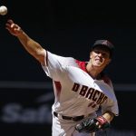 Arizona Diamondbacks' Zack Greinke throws a pitch against the San Francisco Giants during the first inning of an Opening Day baseball game Sunday, April 2, 2017, in Phoenix. (AP Photo/Ross D. Franklin)