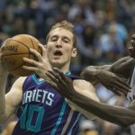 Milwaukee Bucks' Thon Maker, right, defends against Charlotte Hornets' Cody Zeller during the first half of an NBA basketball game, Monday, April 10, 2017, in Milwaukee. (AP Photo/Tom Lynn)