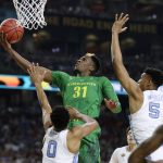 Oregon guard Dylan Ennis (31) drives to the basket over North Carolina's Nate Britt (0) and Tony Bradley (5) during the second half in the semifinals of the Final Four NCAA college basketball tournament, Saturday, April 1, 2017, in Glendale, Ariz. (AP Photo/Mark Humphrey)