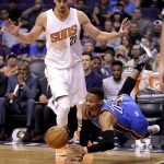 Oklahoma City Thunder guard Russell Westbrook (0) is fouled by Phoenix Suns center Alex Len (21) during the first half of an NBA basketball game, Friday, April 7, 2017, in Phoenix. (AP Photo/Matt York)