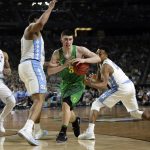 Oregon's Payton Pritchard (3) drives between North Carolina's Kennedy Meeks, left, and Nate Britt during the second half in the semifinals of the Final Four NCAA college basketball tournament, Saturday, April 1, 2017, in Glendale, Ariz. (AP Photo/Mark Humphrey)
