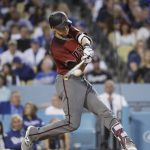 Arizona Diamondbacks' Nick Ahmed hits an RBI single during the fourth inning of a baseball game against the Los Angeles Dodgers, Saturday, April 15, 2017, in Los Angeles. (AP Photo/Jae C. Hong)