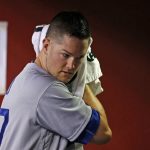 Los Angeles Dodgers' Alex Wood wipes sweat from his head during the fifth inning of the team's baseball game against the Arizona Diamondbacks on Friday, April 21, 2017, in Phoenix. (AP Photo/Ross D. Franklin)