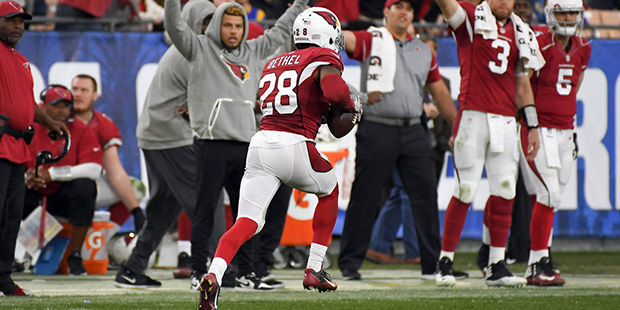 Arizona Cardinals cornerback Justin Bethel returns an interception for a touchdown during the secon...