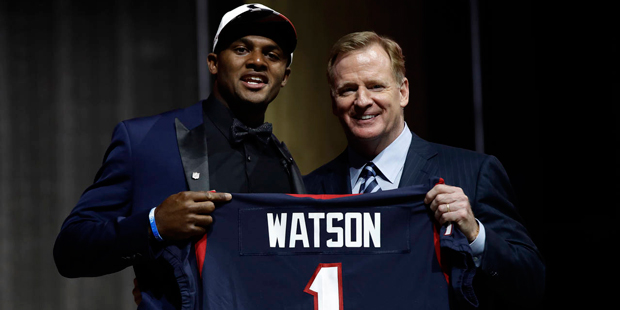 Clemson's Deshaun Watson, left, poses with NFL commissioner Roger Goodell after being selected by t...