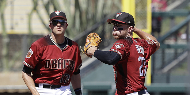 Arizona Diamondbacks' Brandon Drury throws to first for the double play during the second inning of...