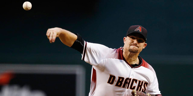 Arizona Diamondbacks' Zack Godley throws a pitch against the San Diego Padres during the first inni...